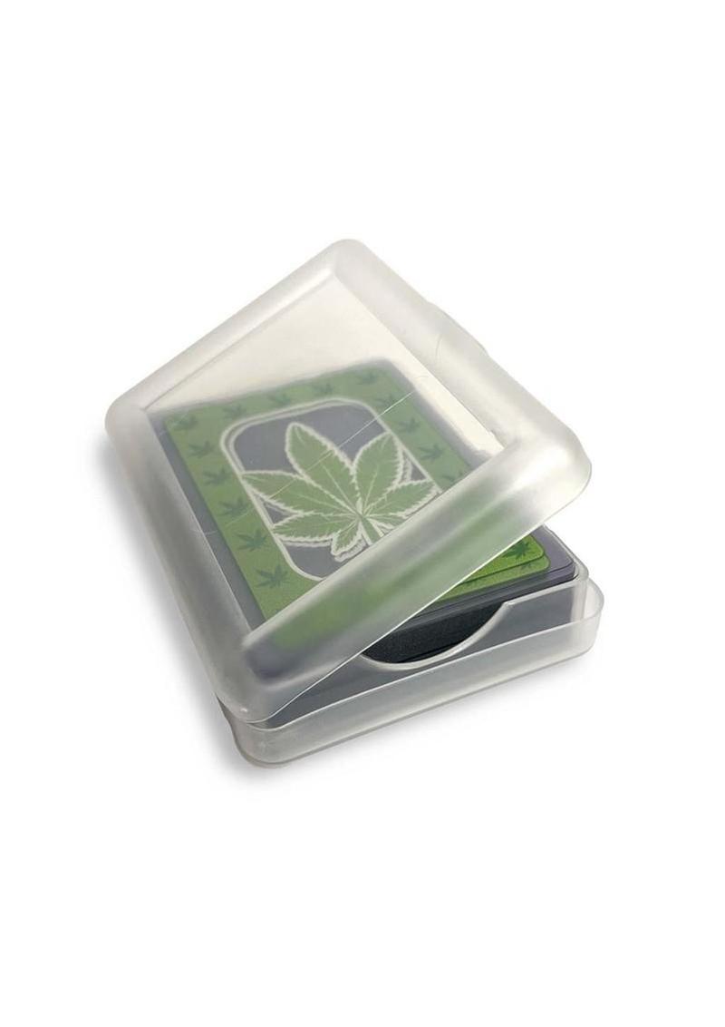 Small transparent container with a green leaf design on a white background